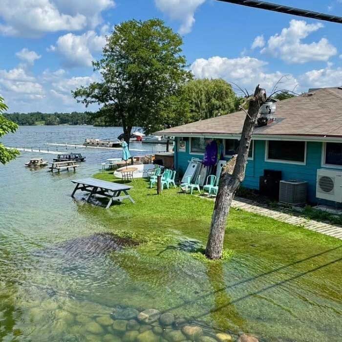Highwater Bar and Grill exterior with lake and outdoor seating
